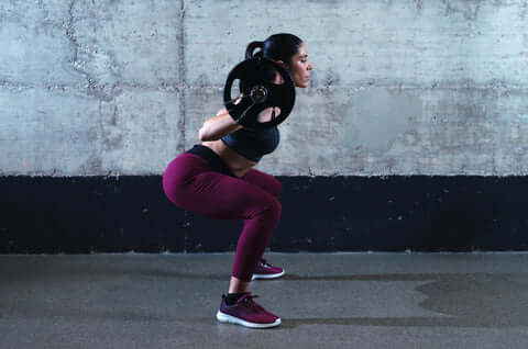 woman doing a squat press